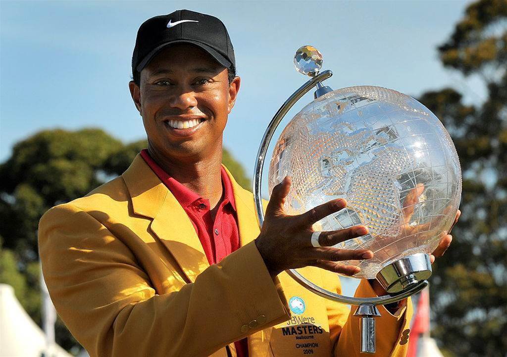 Tiger Woods holding a trophy