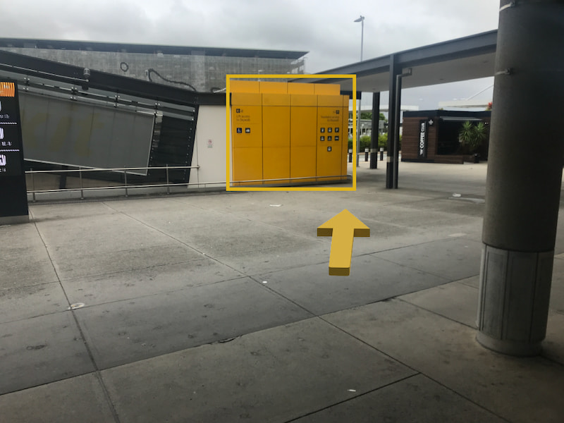 Yellow arrow indicating to use the lift to access the Skywalk