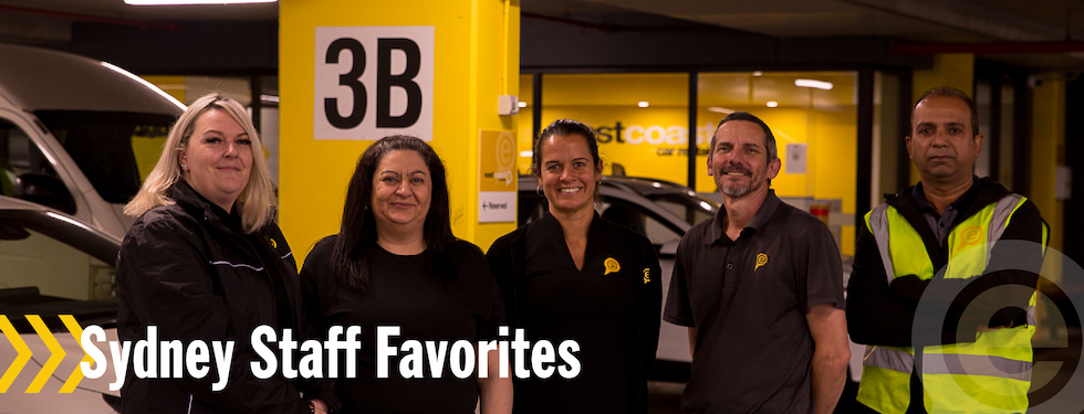 Group photo of 5 car hire employees at East Coast Car Rentals