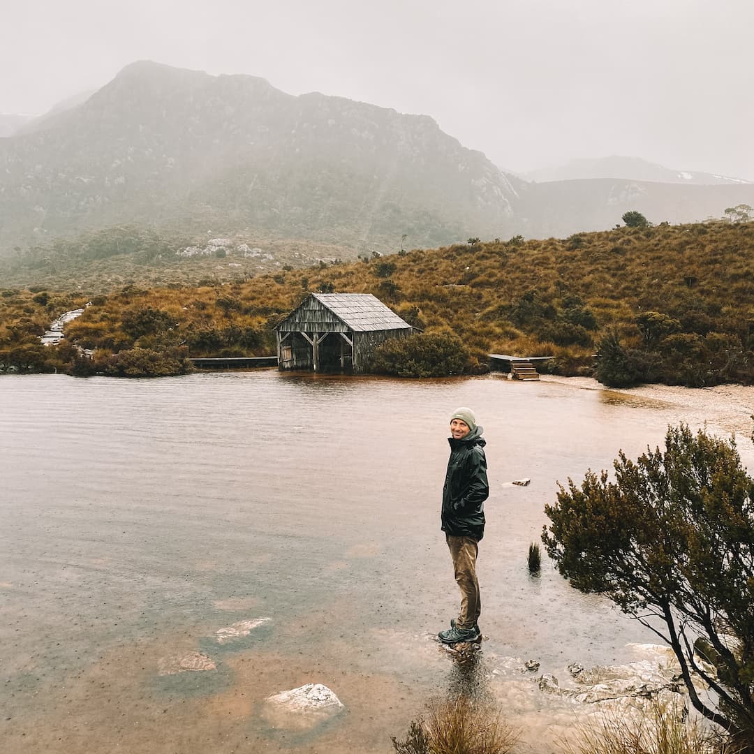 Man Standing at Dove Lake in Tasmania