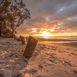 Sunset on Fraser Island | Featured image for Queensland Road Trip Destinations blog for East Coast Car Rentals.