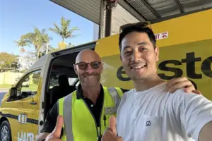 East Coast Car Rentals team with shuttle bus